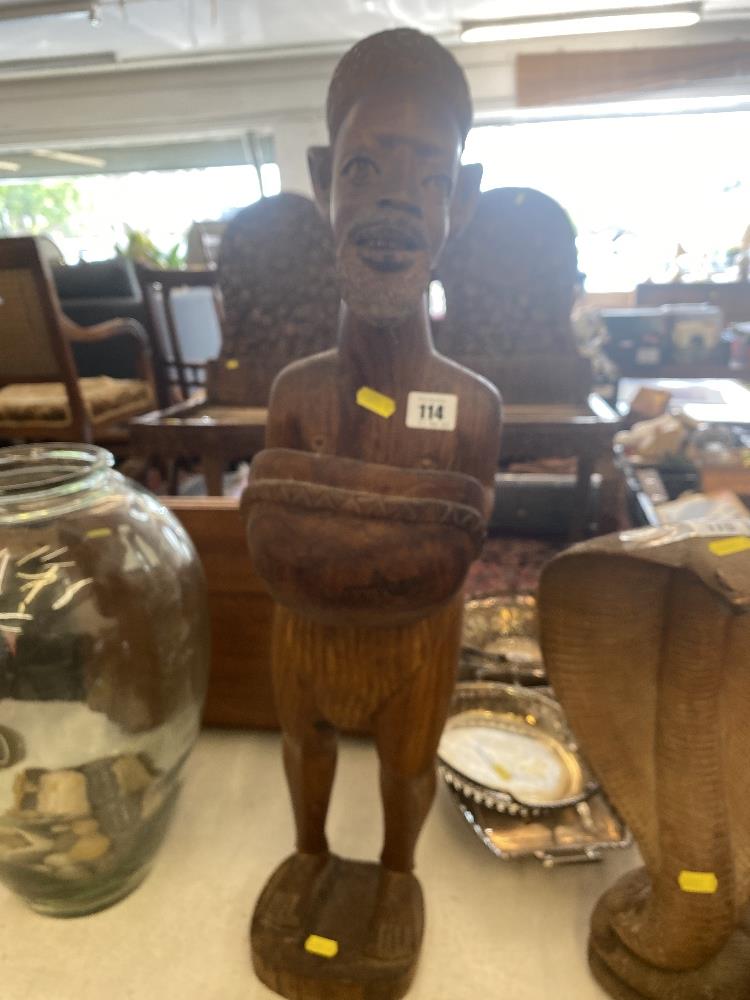 A wooden figure of a man