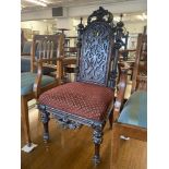 A decorative carved hall chair