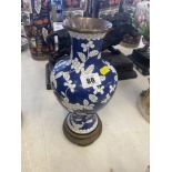 A blue and white cloisonne vase on stand