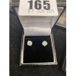 A pair of Diamond single stone earrings,