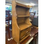 An Ercol old colonial waterfall bookcase