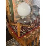 A Mid century glass top coffee table,