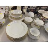 A Royal Doulton 'Regent' dinner service (36 pieces) and seven Royal Doulton plates