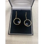 A pair of yellow metal and Sapphire set earrings