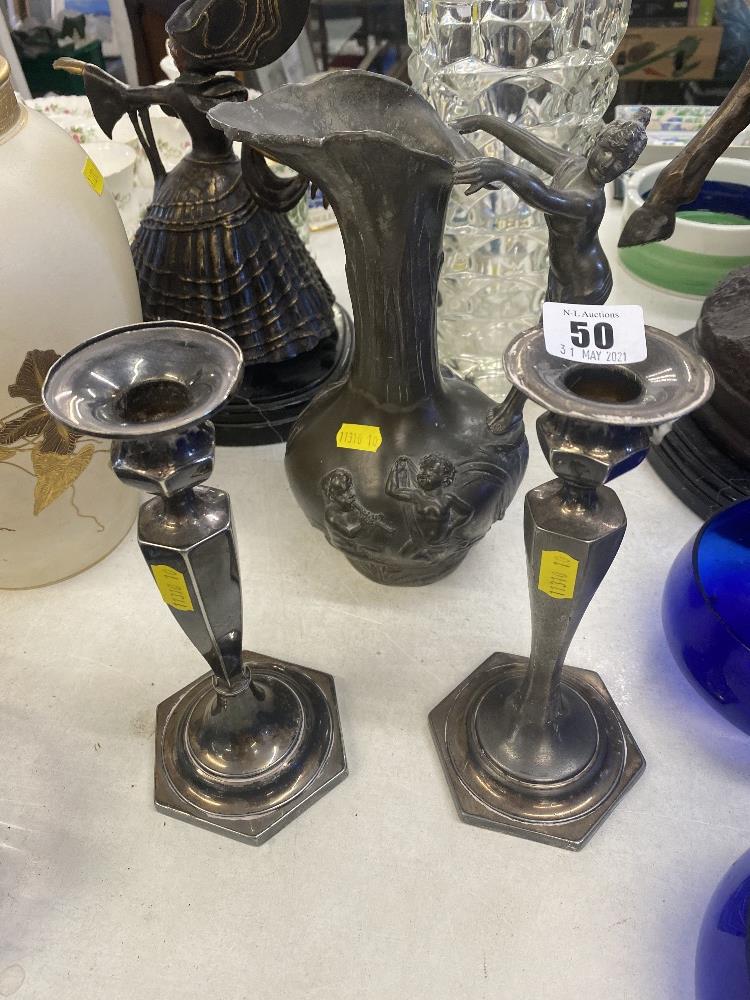 A Pewter decorative jug and candlesticks