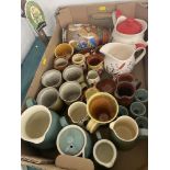 A box of assorted pottery items inc.
