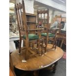 An Ercol old colonial dining table,