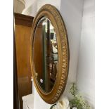 A gilt framed Oval mirror