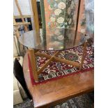 A Mid century glass top coffee table,