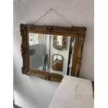 A gilt framed mirror