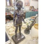 A bronze lady with cane