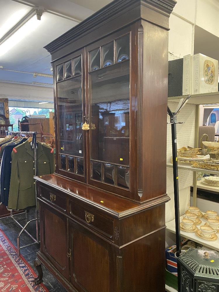 An Edwardian Mahogany bookcase with cupboard under