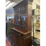An Edwardian Mahogany bookcase with cupboard under
