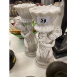 A pair of marble Cherub candlesticks