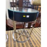 A modern of black ash and chromium plated side table
