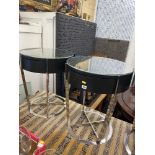 A modern pair of black ash and chromium plated side tables