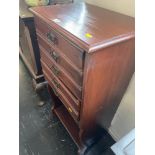 A music cabinet with fall front drawers