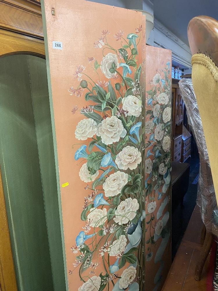 A hand painted four fold floral decorated screen/ room divider