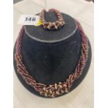 A Garnet multi strand necklace and matching bracelet