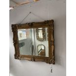 A gilt framed mirror