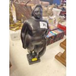 A bronze Botero style lady