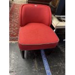A red upholstered nursing chair
