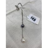 A 14ct white gold chain suspended with two Pearls,