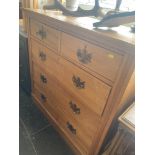 A Satinwood two over three Edwardian chest of drawers