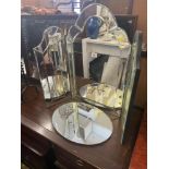 A decorative dressing mirror and another