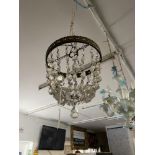 A pair of crystal chandeliers and two matching wall lights