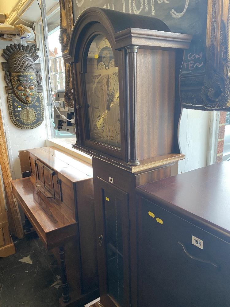 A Mahogany Moon dial musical long case clock