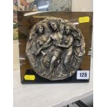 An early silver plated plaque with figures, signed,