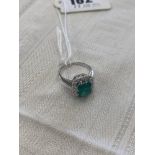 An 18ct White Gold, Emerald and Diamond cluster ring, Emerald 2 1/2 carats poss.