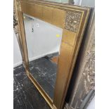 A gilt framed mirror