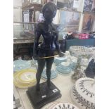 A bronze lady with cane,