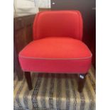 A red upholstered nursing chair