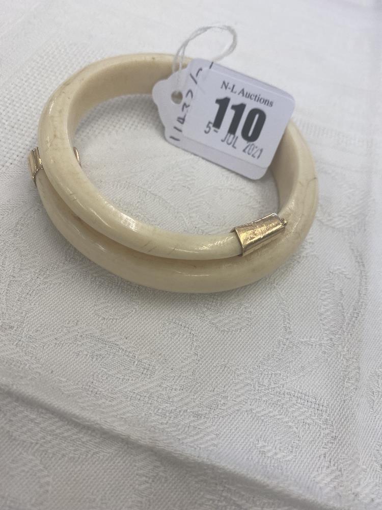 A Boars tooth bangle,