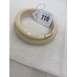 A Boars tooth bangle,