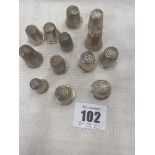 Thirteen Silver and White metal thimbles