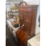 A reproduction bureau bookcase