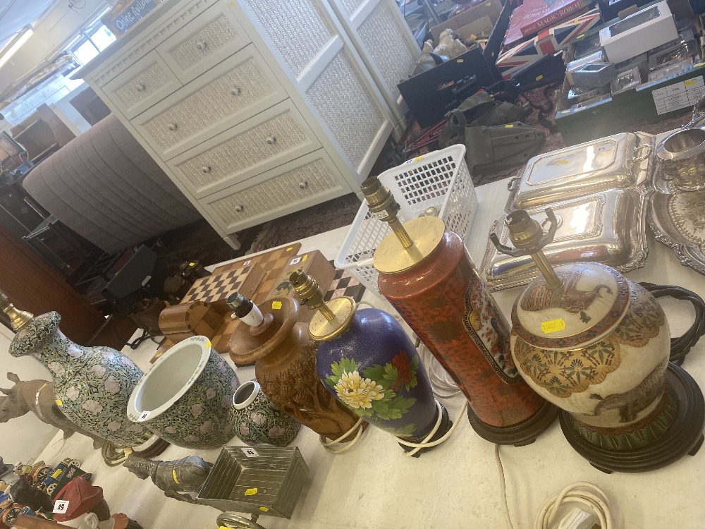 Five decorative lamps and two vases with shades