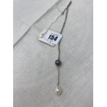 A 14ct white gold chain suspended with two cultured Pearls