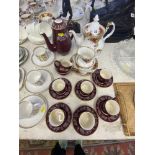 A Royal Albert 'Country Roses' teapot and a Midwinter Maroon coffee set