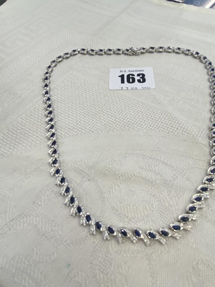 A 14ct gold necklace set with Sapphire and Diamonds, total weight 23 grams,