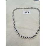 A 14ct gold necklace set with Sapphire and Diamonds, total weight 23 grams,