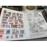 Three stamp albums and a collection of stamps