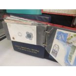 A collection of 1st Day covers with coins- two albums