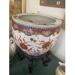 An Oriental fish bowl on stand