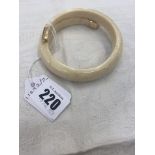A Boars tooth bangle,