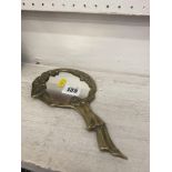 A brass hand mirror